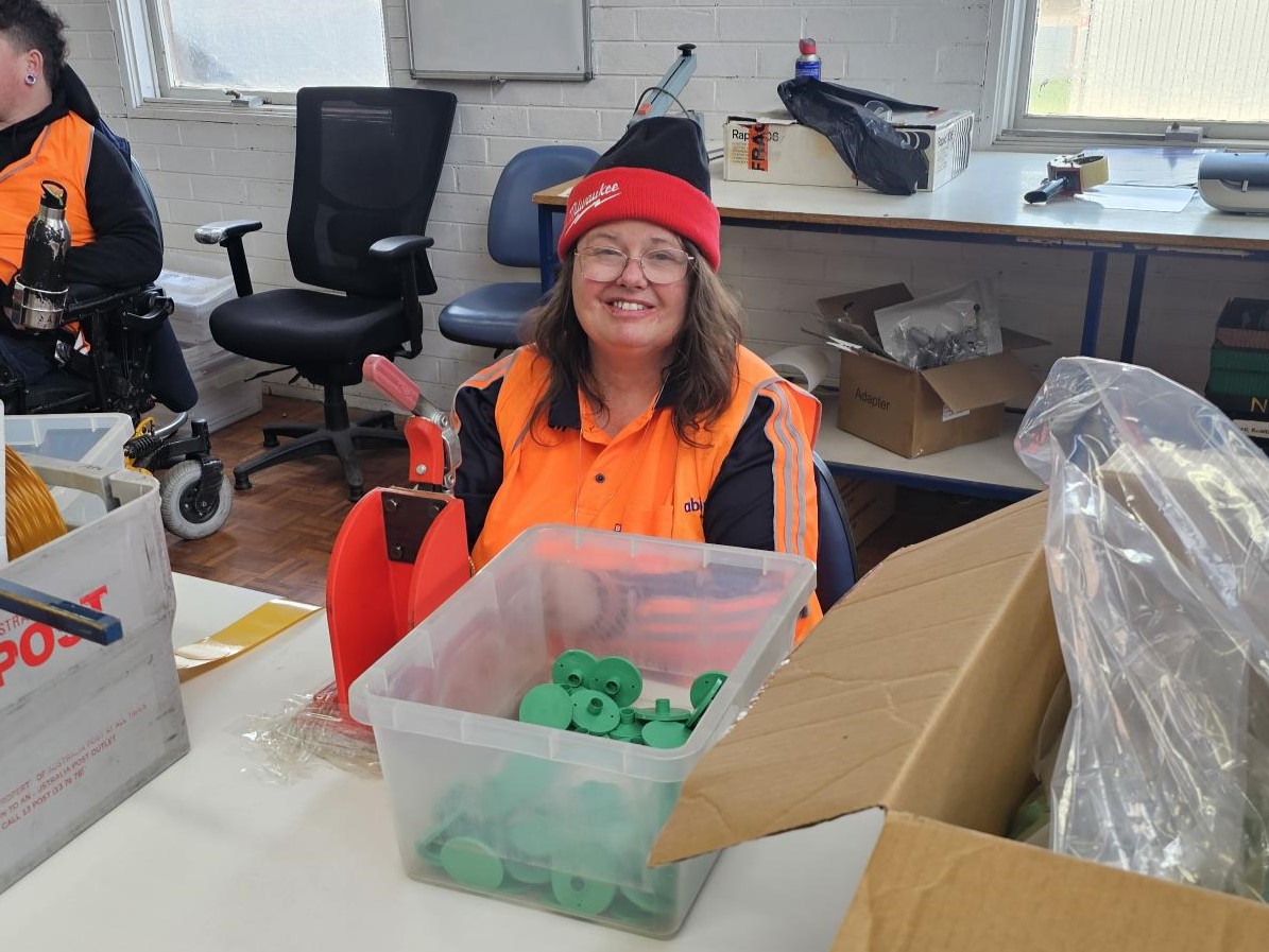 Diane showing a smile in Packing and Assembly.