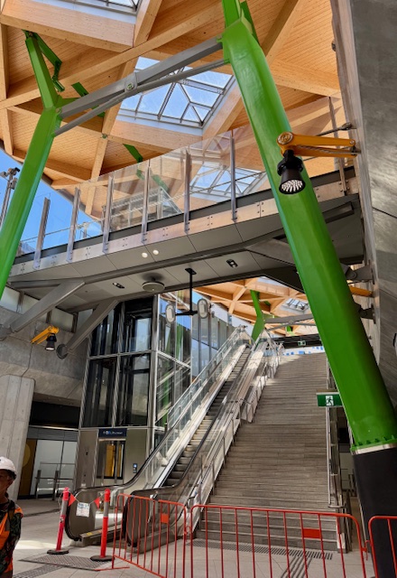 A large set of stairs and an escalator at a train station are fenced off for renovations.
