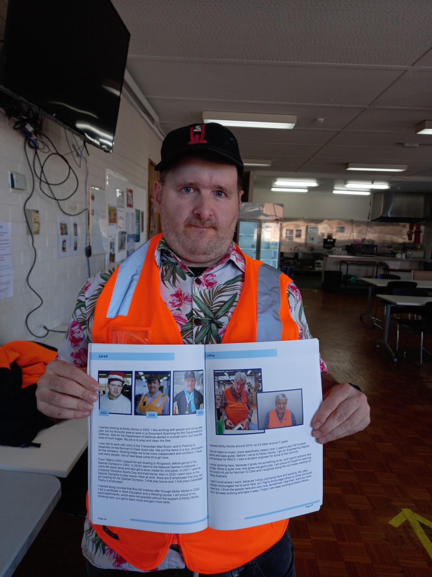 ared proudly shows his page in the Ability Works 60 Year anniversary book.