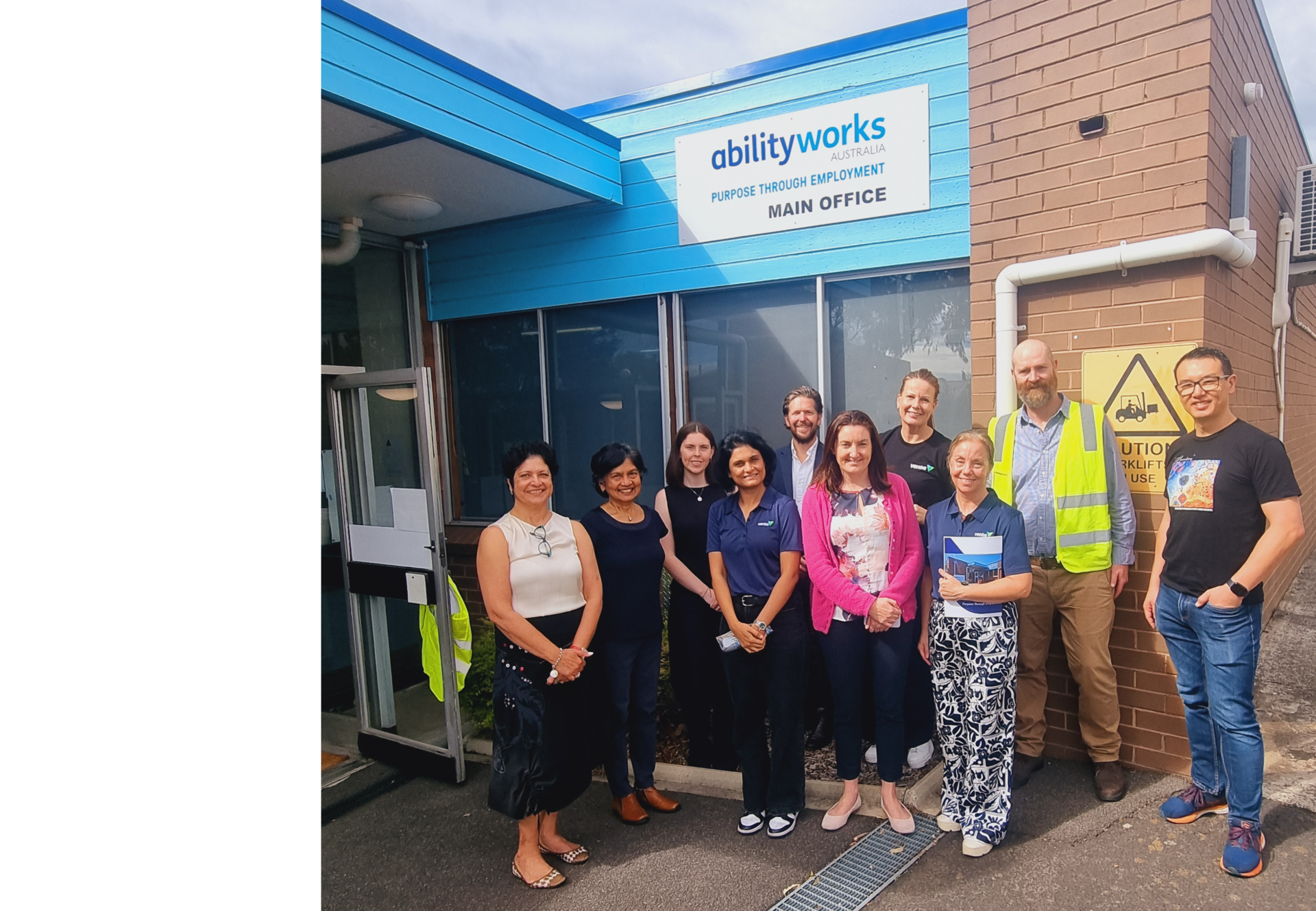 Ventia and Ability Works staff group together outside the Ability Works office.